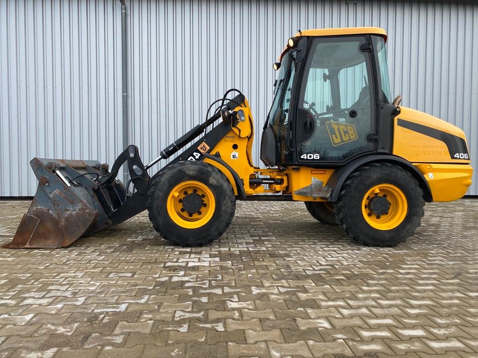 Radlader JCB 406 Palettengabel Klappschaufel mieten bei menzinger