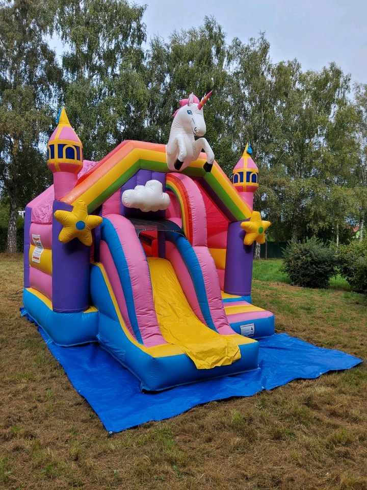 Einhorn Hüpfburg Rutsche mieten bei Eventzubehör Mey
