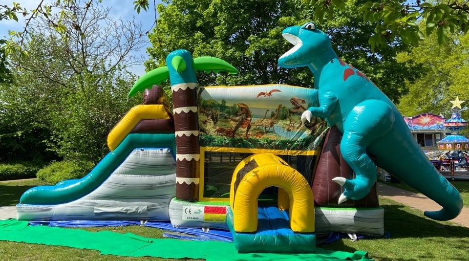 Riesige Dino Dinosaurier Hüpfburg Rutsche mieten bei Spielpunkt