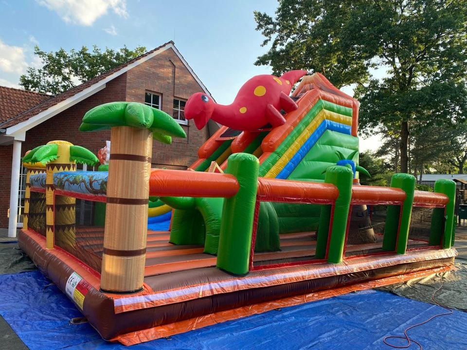 Riesen Dino Hüpfburg Rutsche 10m x 7m mieten bei Spielpunkt