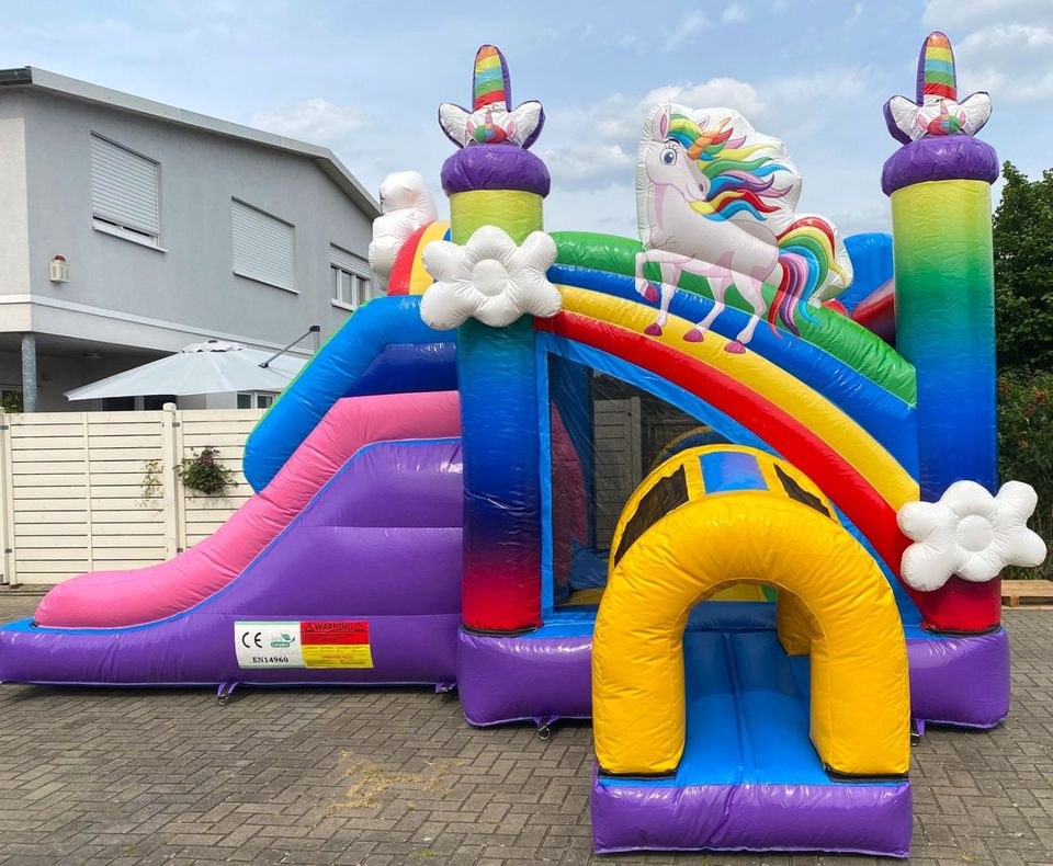 Große Einhorn Hüpfburg Rutsche mieten bei Spielpunkt
