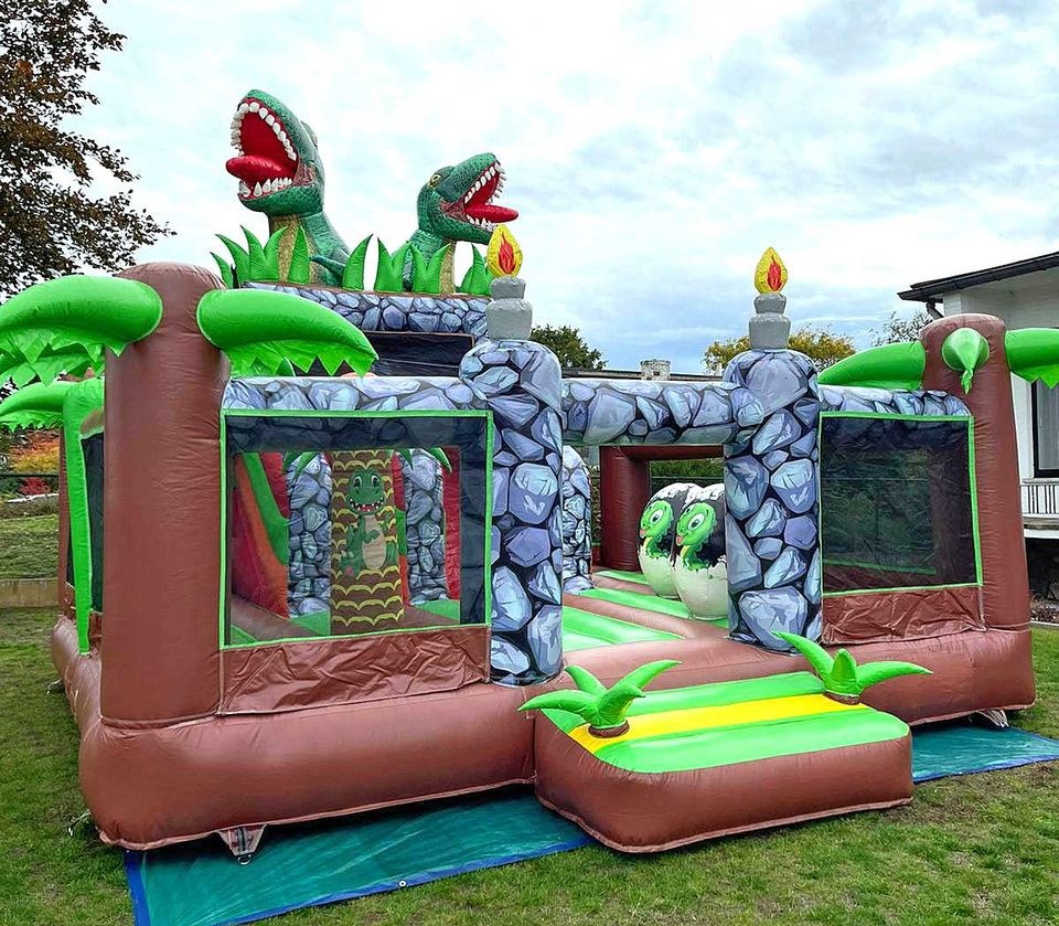 Riesen Dino Hüpfburg Rutsche mieten bei Spielpunkt