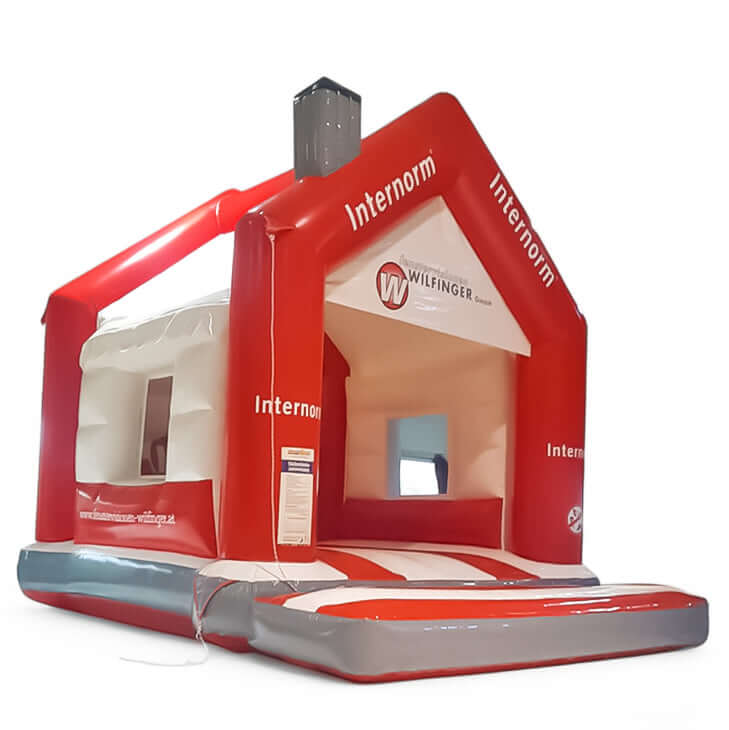 Personalisierte Hüpfburg Internorm mit Fenster und Kamin mieten bei Happy Fun